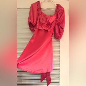 Stunning pink satin cocktail dress that is sure to steal the show!